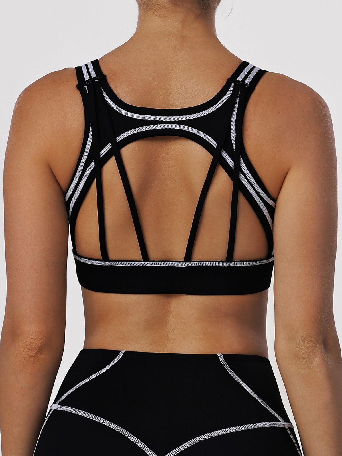 Black Sports Bra with Contrast Piping and Open Back